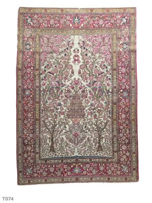 an antique persian rug with a floral design on a white background