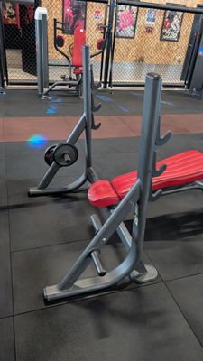 a red bench and a red bench in a gym