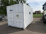 a large white container sitting in the middle of a parking lot