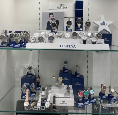 many watches on display in a glass case