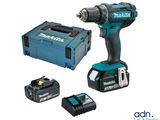 a cordless drill and two batteries on a white background