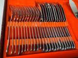a box with a set of forks and spoons in it