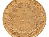 une image d'une pièce d'or sur fond blanc
