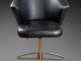 an image of a black chair with a wooden base and a black seat