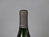 a bottle of wine that is sitting on a table