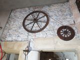 an overhead view of a room with a stone floor and a wheel
