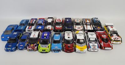 a lot of toy cars sitting on a white surface