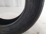 a close up of a tire on a white surface