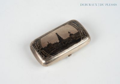 a silver case with a picture of a city on it