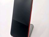 a cell phone that is sitting on top of a stand