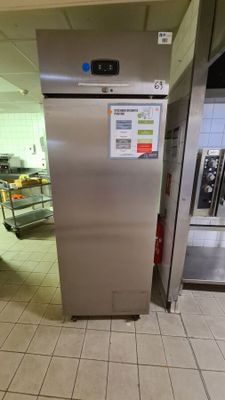 a stainless steel refrigerator in a commercial kitchen