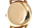an image of a close up of a watch on a white surface