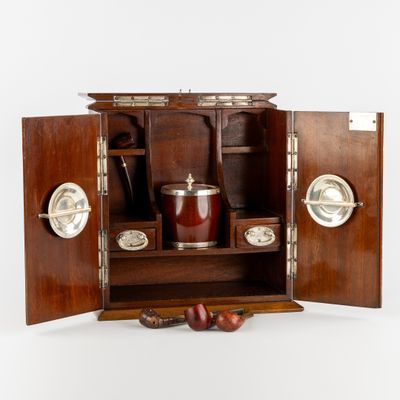 a small wooden cabinet with a bottle of wine inside of it