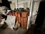 a pile of orange bricks stacked on top of each other in a room