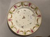 a plate with a floral design on it on a table