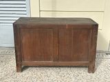 an old wooden cabinet with a door on it