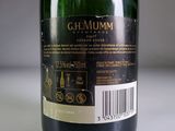 a close up of a bottle of wine on a table