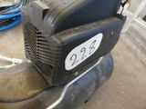 a small air compressor sitting on top of a motor bike