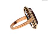 a close up of a ring with a stone in it