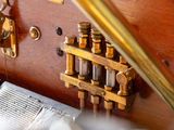 a close up of a wooden suitcase with a bunch of bottles on it