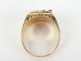 a close up of a gold ring with a diamond in the center