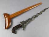 a knife and a wooden handle on a table