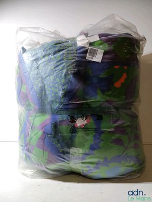 a bag of clothes that is wrapped in plastic
