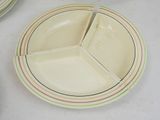 a plate with a divided section sitting on a table