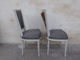 two chairs that are sitting next to each other