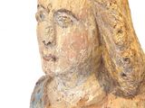 a statue of a woman that is sitting on a table