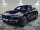 the porsche cayense is parked on a checkered tile floor