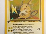 a close up of a pokemon card on a white surface