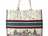 an image of a handbag with flowers and birds on it