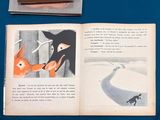 a book with a picture of a fox and a cat
