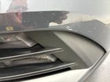 a close up of a car ' s grille with a person taking a picture in the mirror