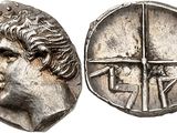 a silver coin with an image of a man on it