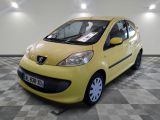 a picture of a small yellow car parked in a garage