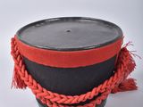a close up of a hat with a rope around it