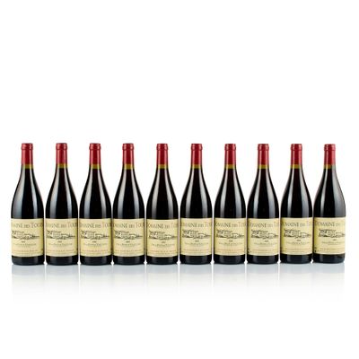six bottles of red wine lined up in a row