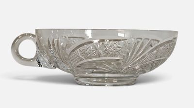an image of a glass bowl with a handle on a white background