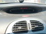 a car dashboard with a digital clock on it