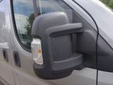an image of a side view mirror of a van