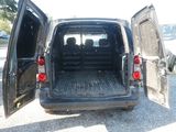 a black van with its doors open in a parking lot
