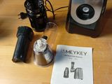 a coffee maker on a table with a manual for making coffee