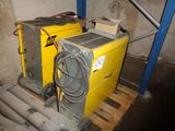 a yellow machine that is sitting on a pallet