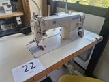 a sewing machine sitting on a table in a room