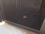 a microwave that has a small piece of food inside of it