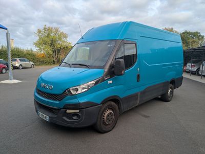 a picture of a blue van parked in a parking lot