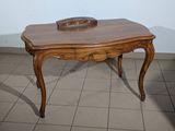 a wooden table with a bowl on top of it