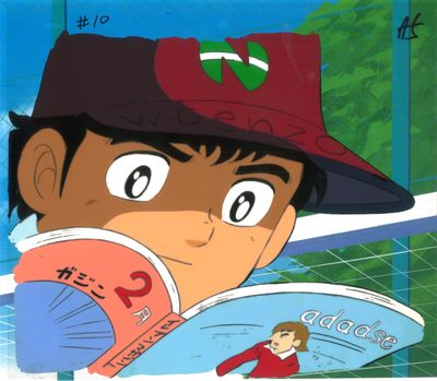 image de bande dessinée représentant un garçon en train de lire un livre et portant un bonnet rouge